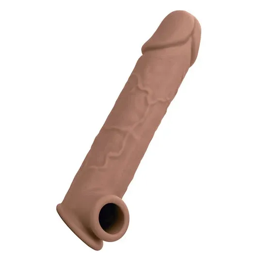 Extension pénienne réaliste CalExotics peau marron, ajout 5 cm avec sangle scrotale intégrée, silicone liquide ultra-doux.