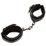 Vue d'ensemble des poignets de contrainte rembourrés CALEXOTICS noirs avec boucles réglables.