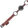 Bavaglio BDSM BEGME Red Edition in pelle vegana rossa con fori di ventilazione e cinghia regolabile.