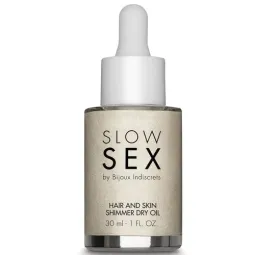 Aceite seco iluminador Slow Sex 30 ml, destellos dorados, aroma a coco, hidratante y brillante para piel y cabello.