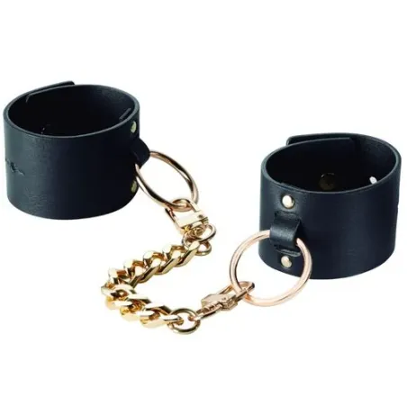 Breite schwarze Bondage-Fesseln aus veganem Leder, Marke Bijoux Maze, Doppelfunktion als Armband und Handschellen.