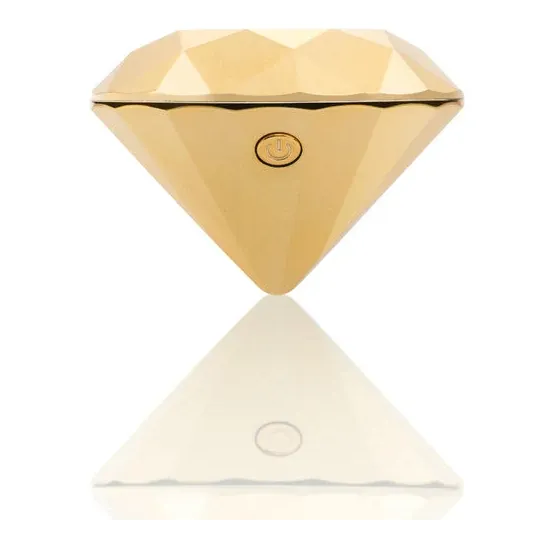 Gold diamond-shaped clitoral vibrator by Bijoux 21, designed for external stimulation.