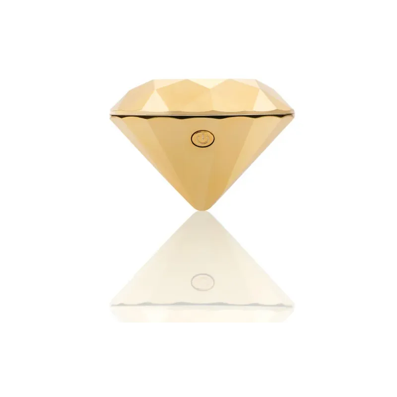 Vibrateur clitoridien en forme de diamant doré de la marque Bijoux 21, pour stimulation externe.