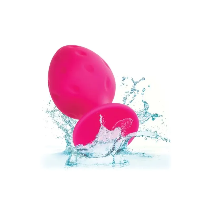 Plug anale rosa in silicone CALEXOTICS con base ventosa, tenuta sicura e texture varia per sensazioni intense.