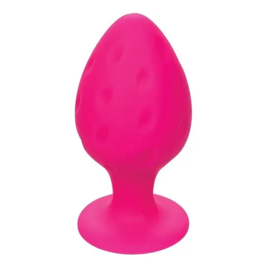 Plug anale rosa in silicone CALEXOTICS con base ventosa, tenuta sicura e texture varia per sensazioni intense.