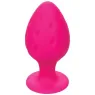 Plug anale rosa in silicone CALEXOTICS con base ventosa, tenuta sicura e texture varia per sensazioni intense.