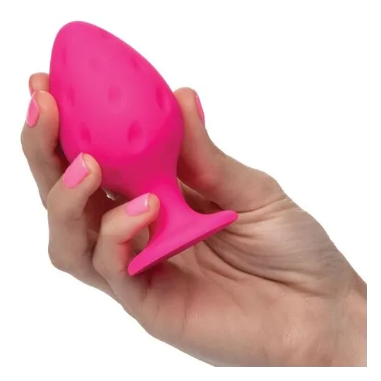 Plug anale rosa in silicone CALEXOTICS con base ventosa, tenuta sicura e texture varia per sensazioni intense.