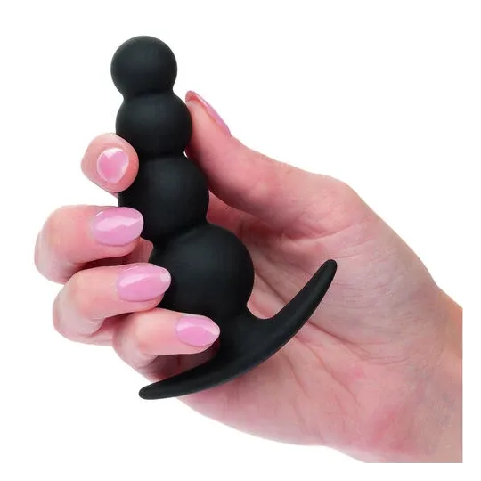 Bouchon de perles graduées CalExotics en silicone noir sur fond blanc, plug anal progressif